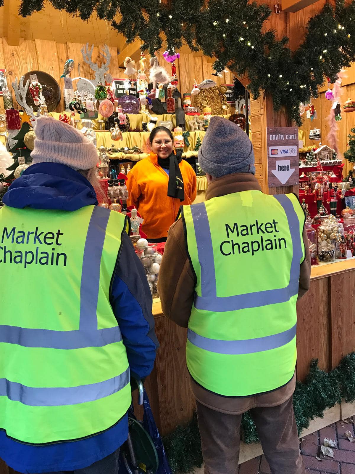 Market chaplains visiting a stallholder