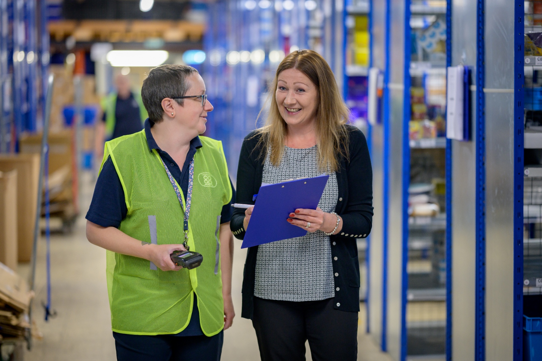 Two colleagues talking together in a workplace